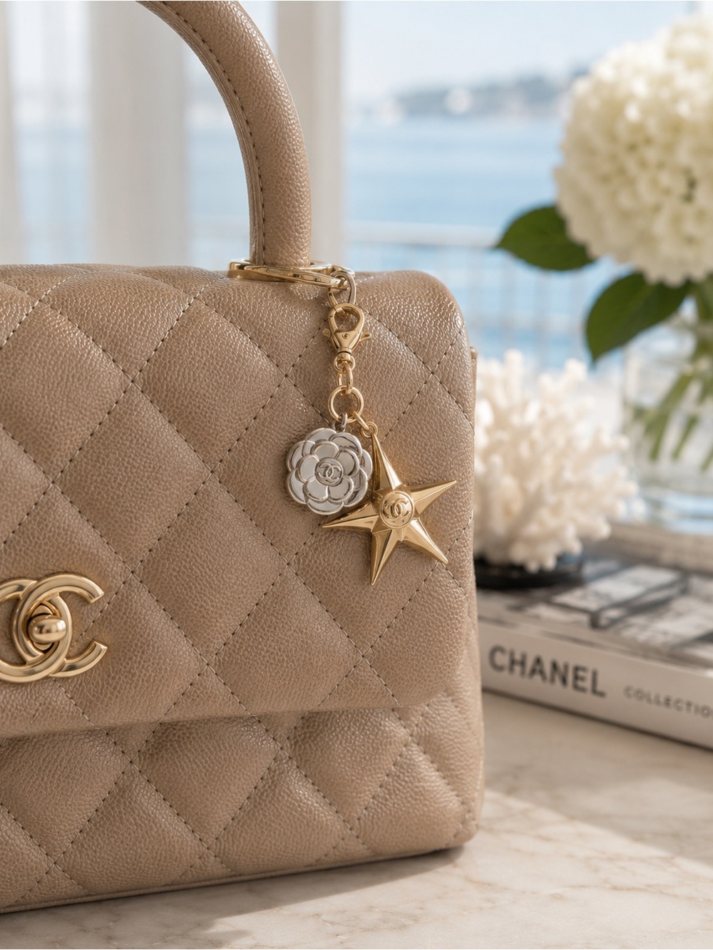 NWOT Authentic CHANEL Gold Star and Silver Camellia Flower Charm.